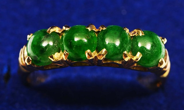 Appraisal: A CHINESE GOLD RING set four jade stones