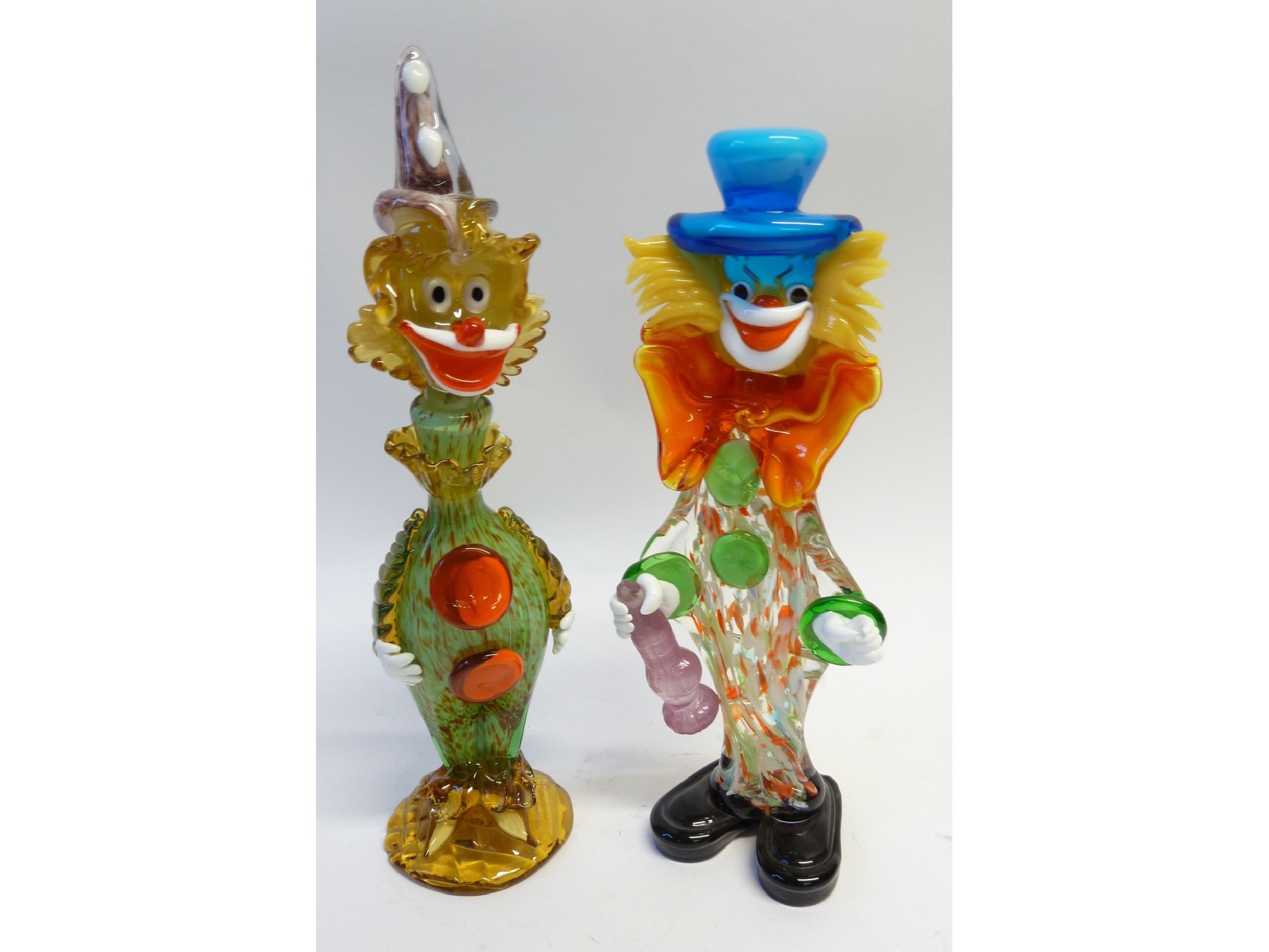 Appraisal: TWO COLOURED GLASS FIGURES OF CLOWNS one a decanter and