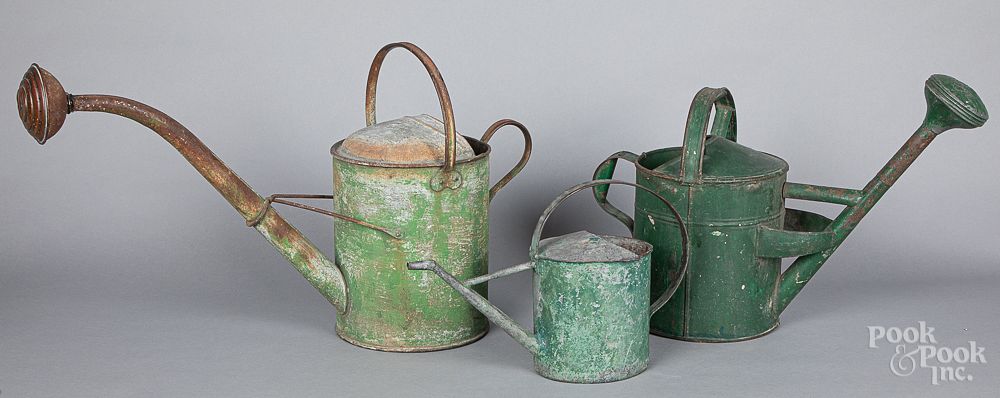 Appraisal: Three green painted tin watering cans Three green painted tin