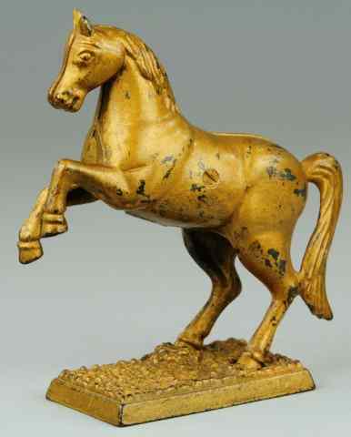 Appraisal: PRANCING HORSE ON PEBBLED BASE STILL BANK Scarce cast iron