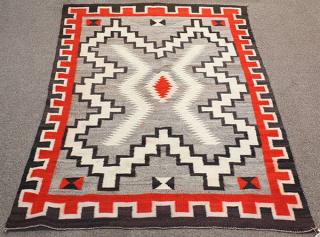 Appraisal: Antique Navajo carpet Antique Navajo carpet having a cloud pattern