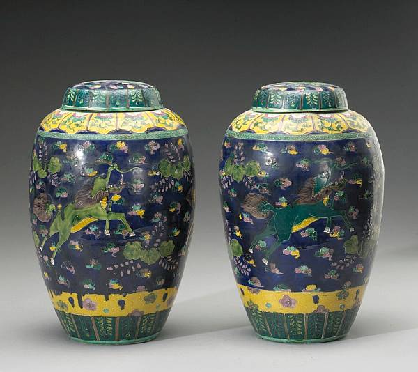 Appraisal: A pair of polychrome enameled porcelain covered jars th Century