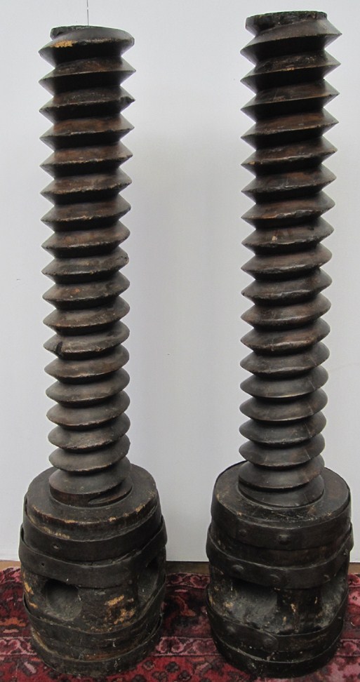 Appraisal: PAIR OF METAL-BOUND AND CARVED WOOD WINE PRESS SCREWS H