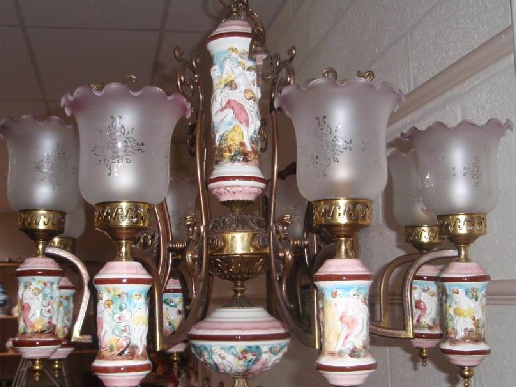 Appraisal: A Continental brass and porcelain eight light electrolier together with