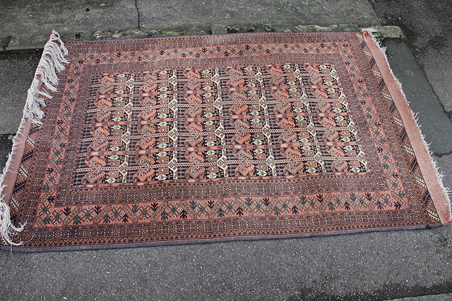 Appraisal: AN AFGHAN BOKHARA TYPE RUG with panels of elephant foot