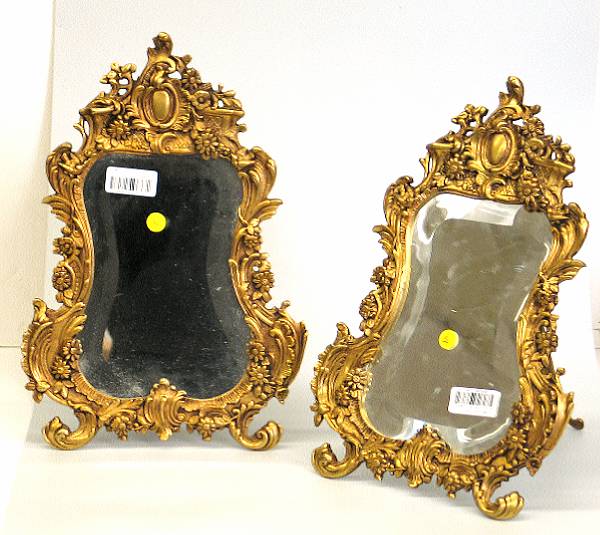 Appraisal: A pair of Louis XV style cast brass dressing mirrors