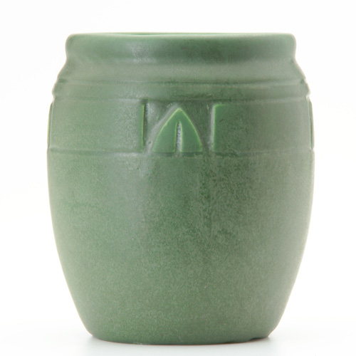 Appraisal: OWENS Matt Green vase with banded geometric decoration near rim