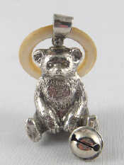 Appraisal: A silver teddy bear rattle with bell and m o