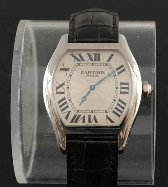 Appraisal: A Cartier Privee platinum wristwatch Manual movement tonneau shaped cream