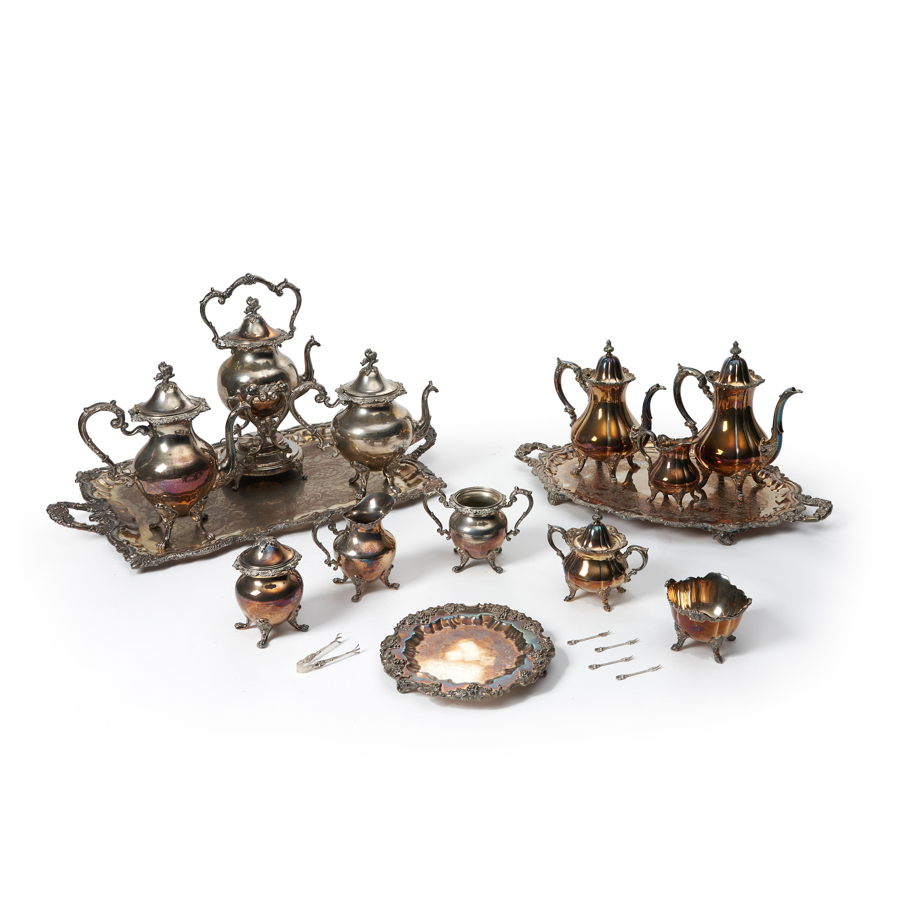 Appraisal: Two Silver-plated Tea Services with teapots creamers sugars and two