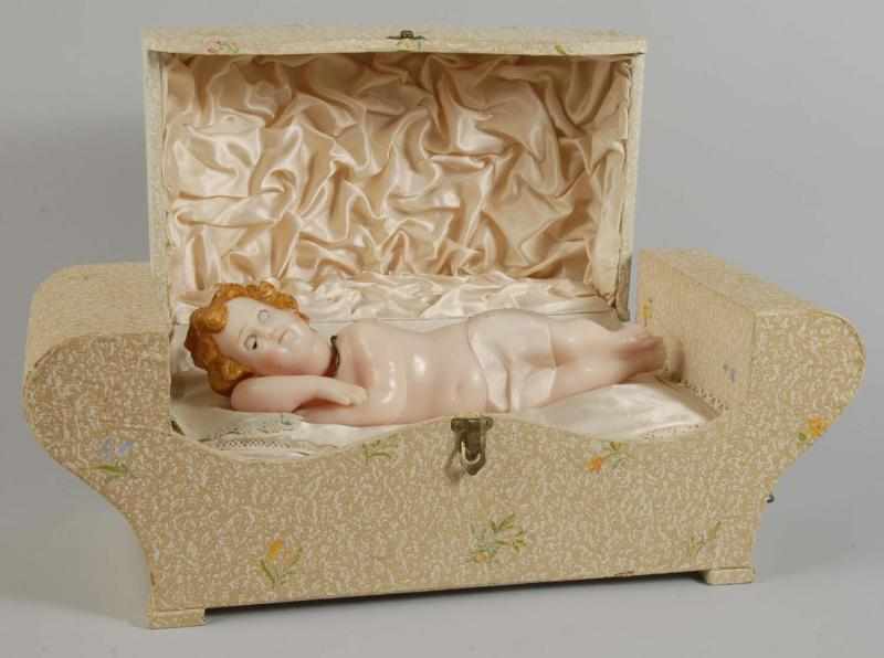 Appraisal: Wax Baby Music Box Description Wax Baby with molded hair