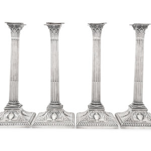 Appraisal: An Assembled Set of Four Victorian and Edwardian Silver Candlesticks