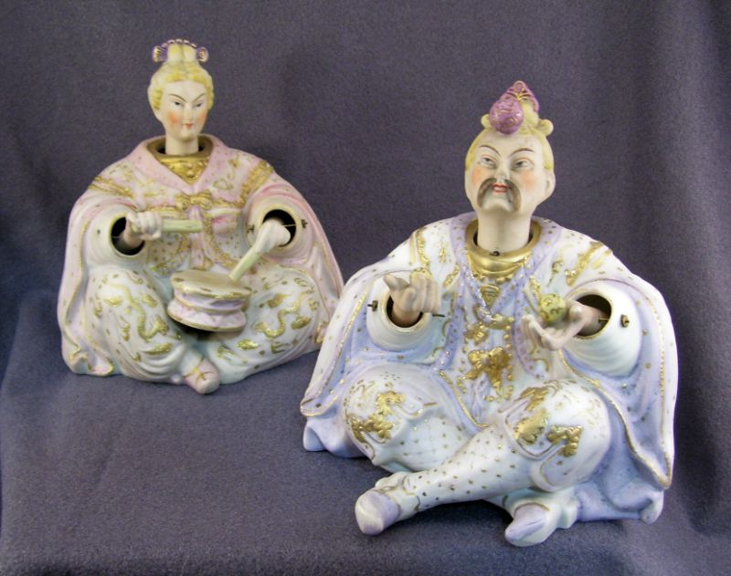 Appraisal: Pair Porcelain Oriental Nodders Pair of hand painted male and