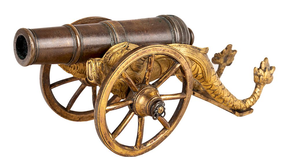 Appraisal: A FRENCH ORMOLU CANNON TH CENTURY A FRENCH ORMOLU CANNON