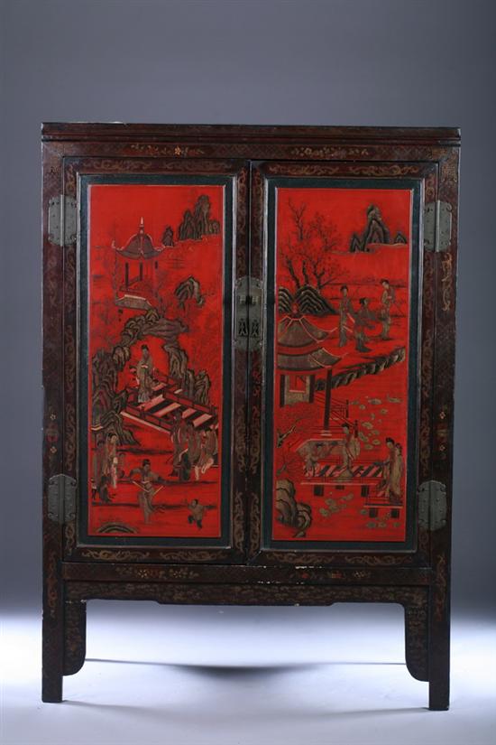 Appraisal: CHINESE RED AND BLACK LACQUERED WOODEN TWO-DOOR CABINET Rectangular top