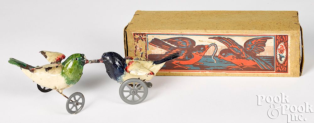 Appraisal: German painted tin clockwork fighting birds toy German painted tin