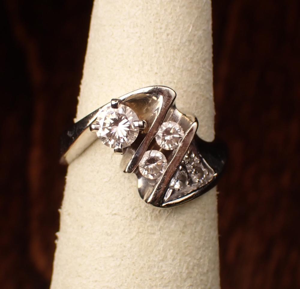 Appraisal: DIAMOND AND FOURTEEN KARAT WHITE GOLD RING set with six