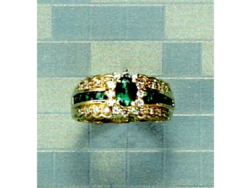 Appraisal: EMERALD AND DIAMOND RING k yellow gold lady's ring centering