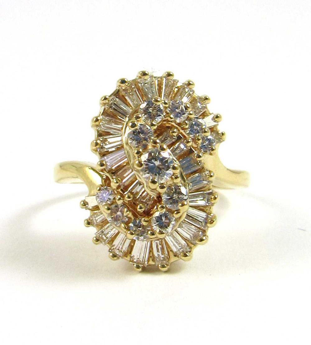 Appraisal: DIAMOND AND FOURTEEN KARAT GOLD COCKTAIL RING with an S-shaped