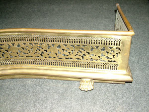 Appraisal: A George III style lacquered brass serpentine fronted fire curb