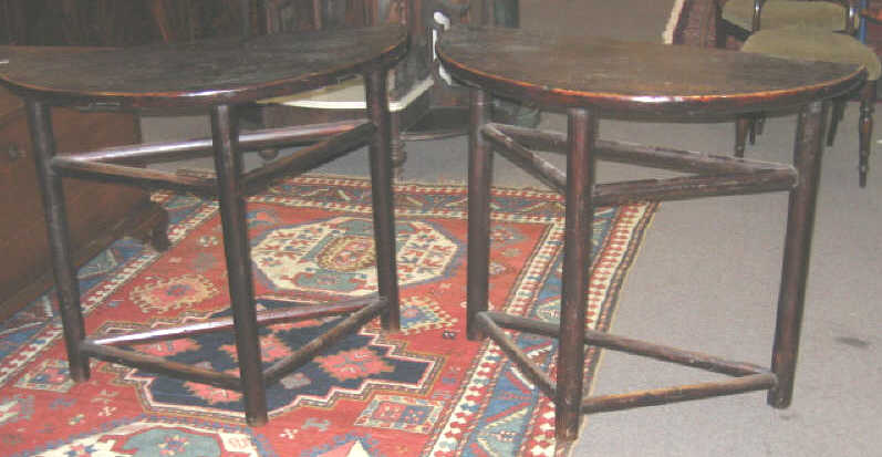 Appraisal: PAIR OF ASIAN DEMILUNE CONSOLE TABLES Each on three round