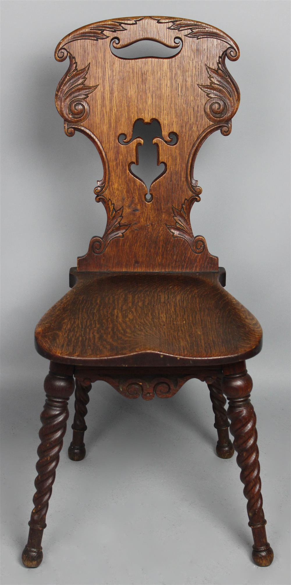 Appraisal: VICTORIAN OAK CARVED AND TURNED HALL CHAIR shaped back with