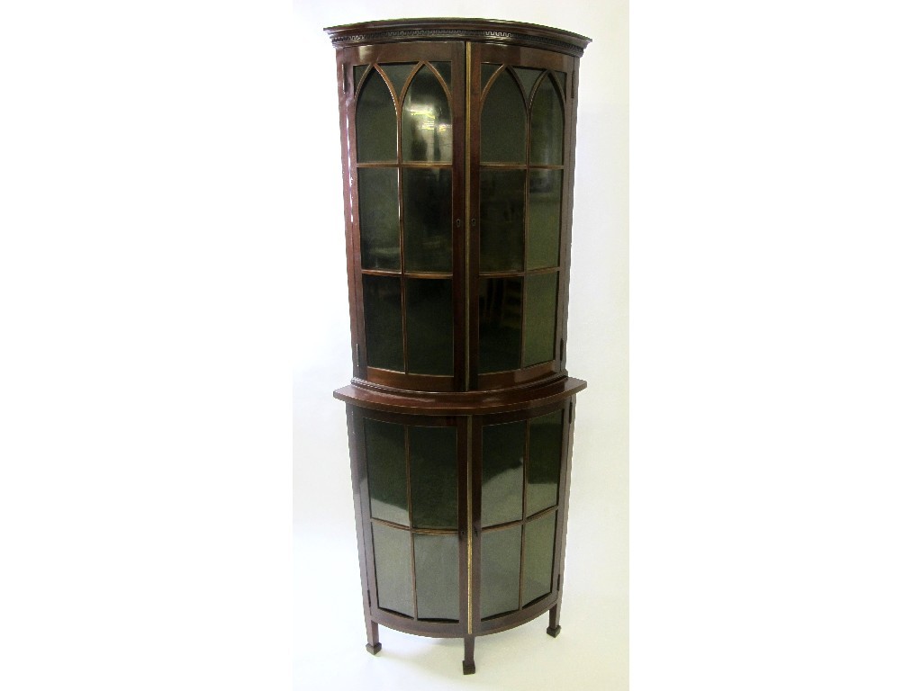 Appraisal: An Edwardian mahogany bow fronted corner cabinet the top with