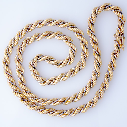 Appraisal: k yg rope chain necklace with entwined wg box link