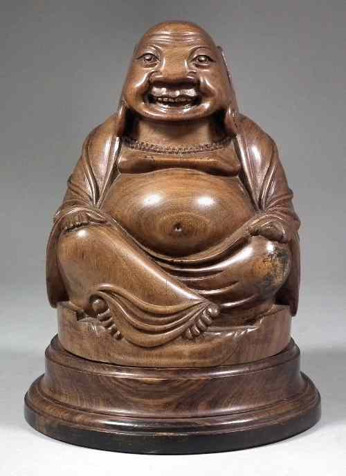 Appraisal: An Eastern carved hardwood figure of a laughing Buddha on