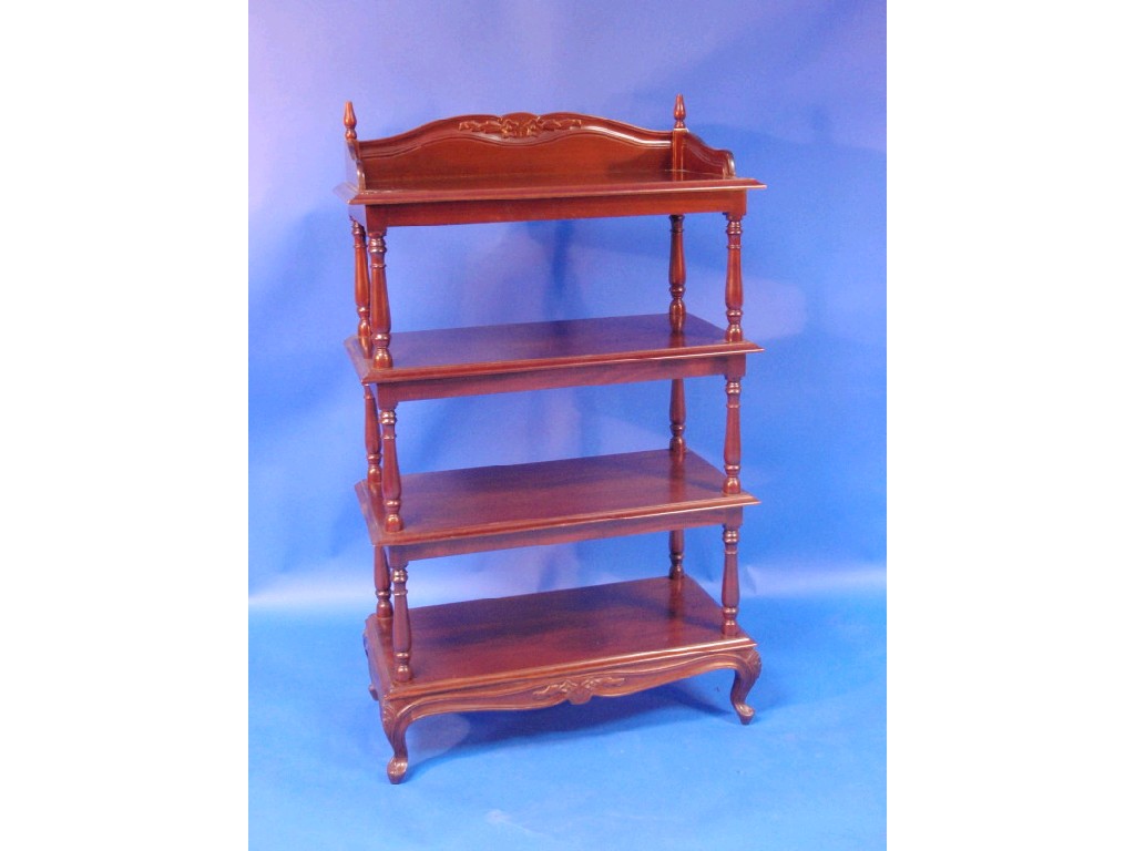 Appraisal: A mahogany four tier whatnot with shaped gallery back and