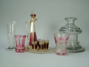 Appraisal: A heavy glass socle shaped decanter with faceted sides on