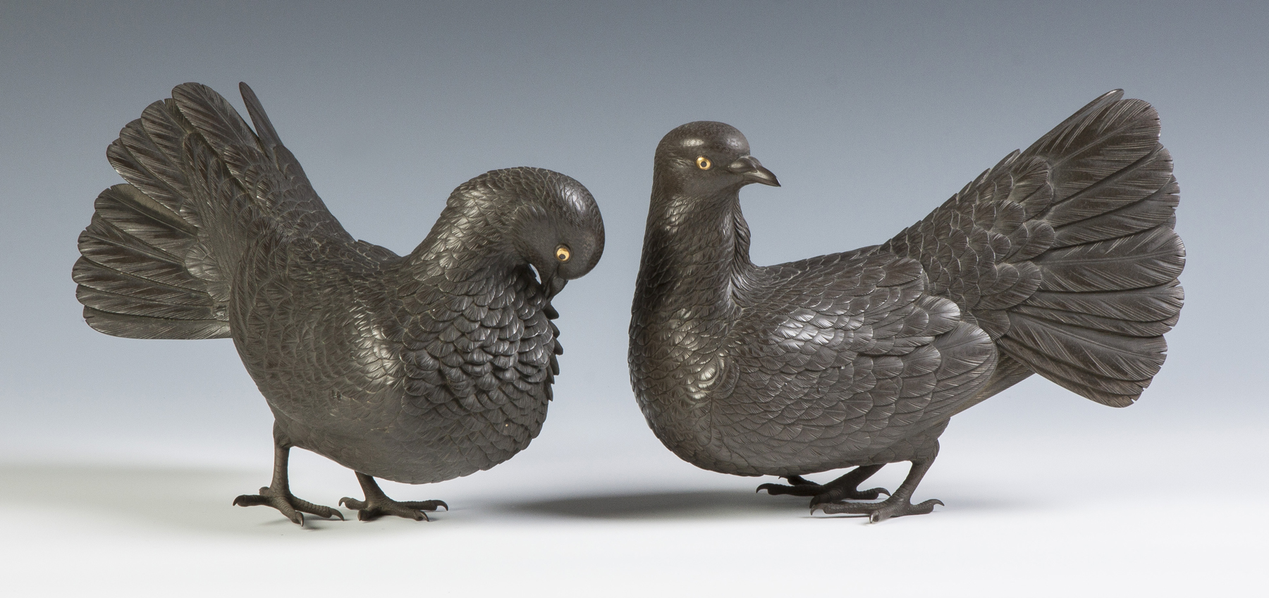 Appraisal: A Fine Pair of Bronze Doves Meji period Signed Gold