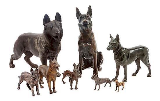 Appraisal: A Group of Eight Bronze and Metal German Shepherds Width