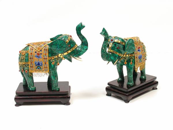 Appraisal: A pair of malachite and jeweled gilt metal elephants on