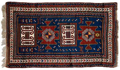 Appraisal: Kazak rug four central medallions on blue ground with quadrupeds