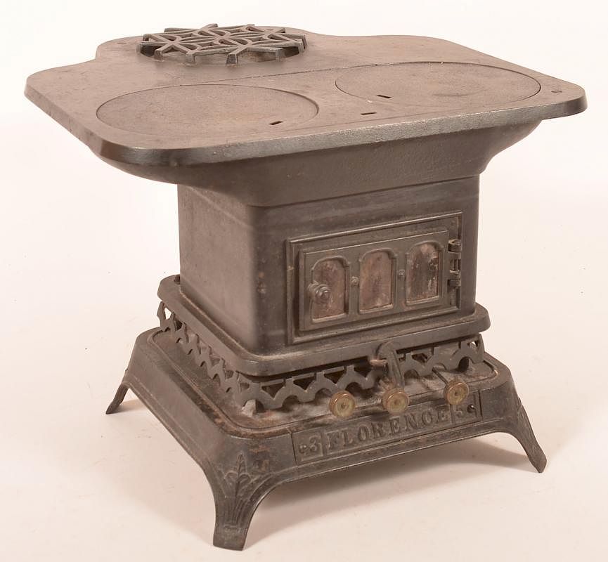 Appraisal: century cast iron miniature cook stove century cast iron miniature