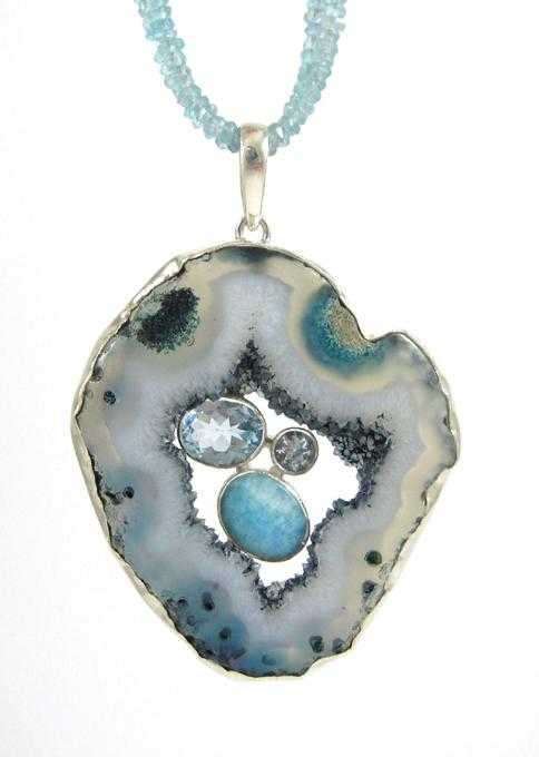 Appraisal: AGATE DRUZY AQUAMARINE AND STERLING PENDANT NECKLACE suspended on a