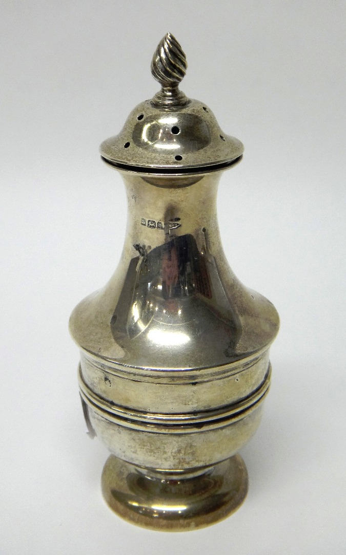 Appraisal: A silver sugar caster with a wrythen knop finial and