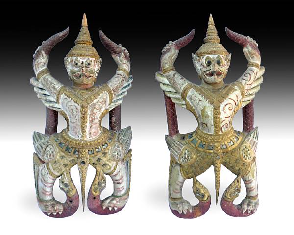 Appraisal: A pair of Thai carved and polychromed wood mythical creatures