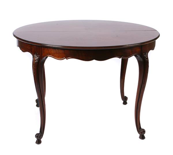 Appraisal: A Louis XV style mahogany dining table with three leaves