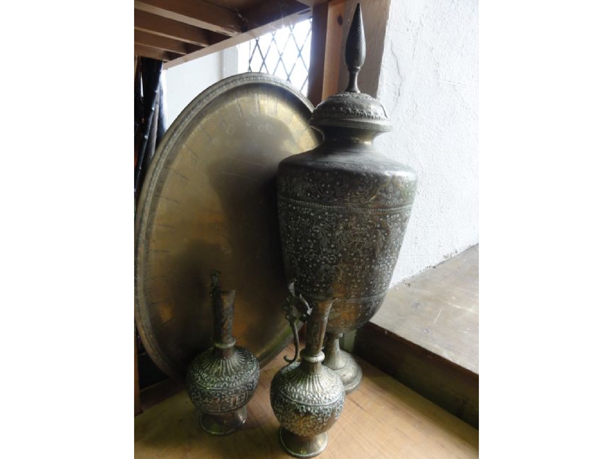 Appraisal: A substantial lidded eastern brass vessel of tapering cylindrical form