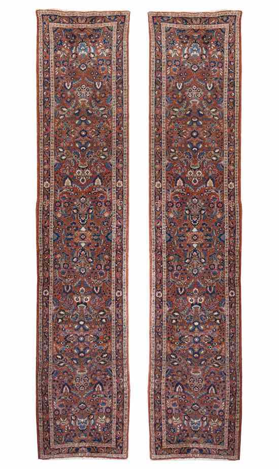 Appraisal: A Pair of Sarouk Wool Runners having allover floral and