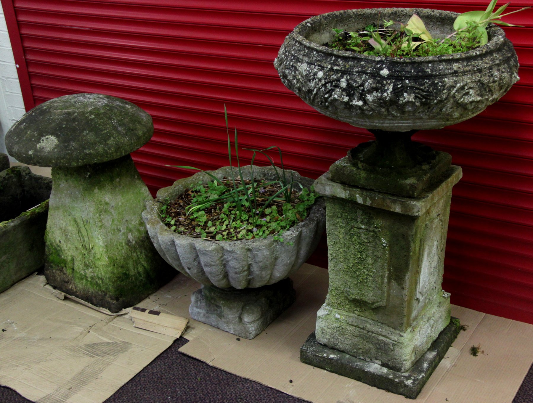 Appraisal: A reconstituted planter of scalloped form on a low plinth