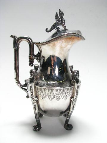 Appraisal: Simpson Hall Silver Plate Syrup Pitcher circa griffin finial with