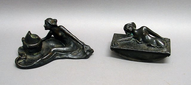 Appraisal: Inkwell with nude female seated on asymmetrical base her right