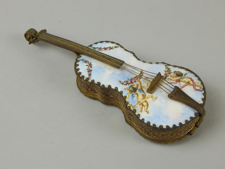 Appraisal: A Continental gilt metal and enamel musical trinket box modelled