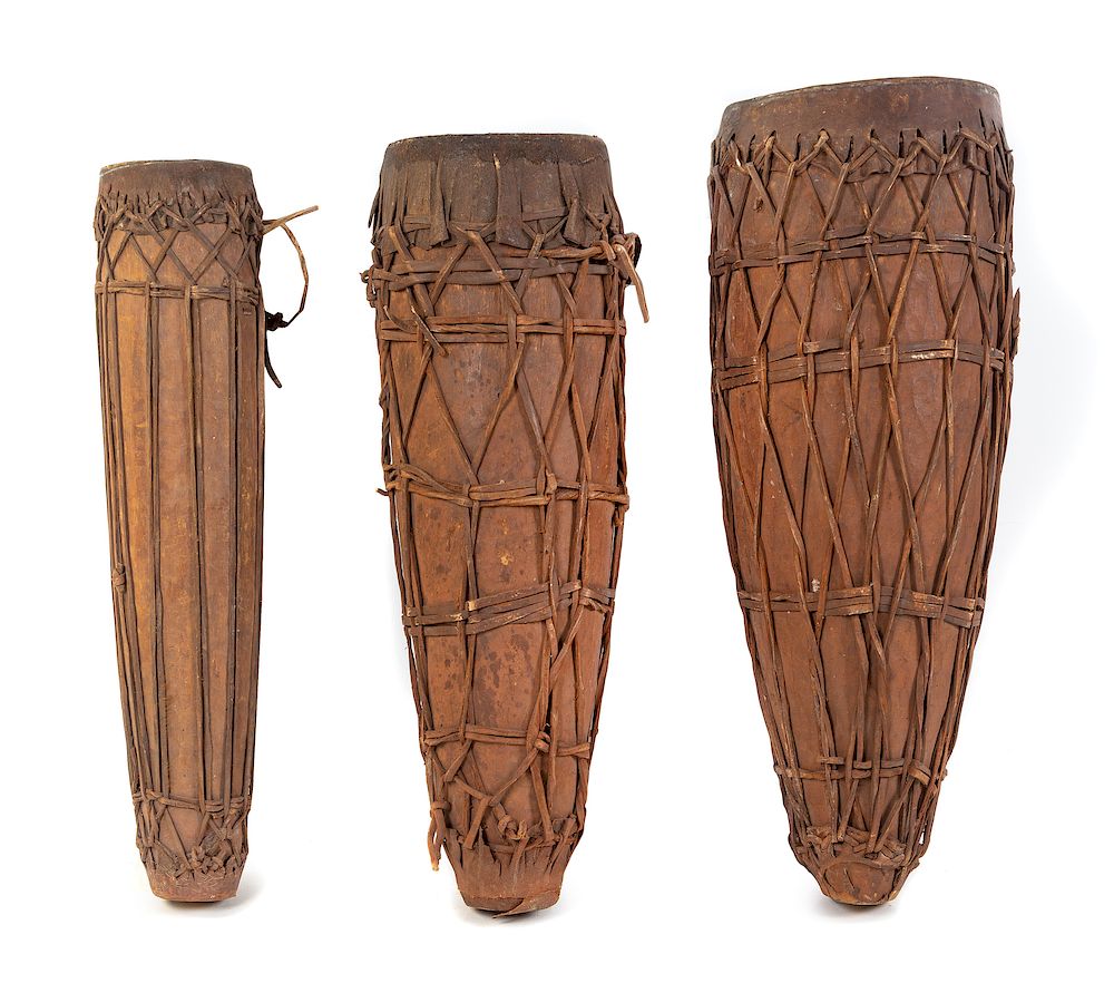 Appraisal: A Set of Three Ngbaka Leather-Bound Drums A Set of