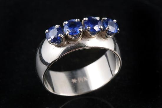 Appraisal: K WHITE GOLD AND SAPPHIRE BAND Row of four matched