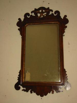 Appraisal: A MAHOGANY FRET FRAMED PIER GLASS the arched oblong plate