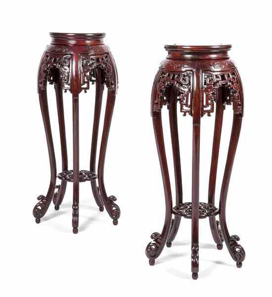 Appraisal: A Pair of Chinese Carved Rosewood Stands each having a